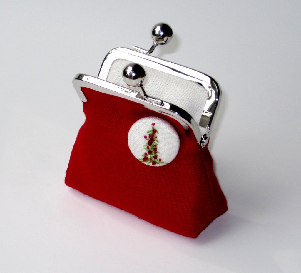 Hand embroidered button on this darling coin clutch!