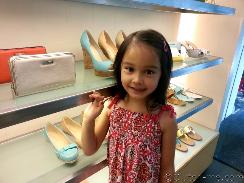 Hayley said "Mom, take a pic of me next to these purses!".